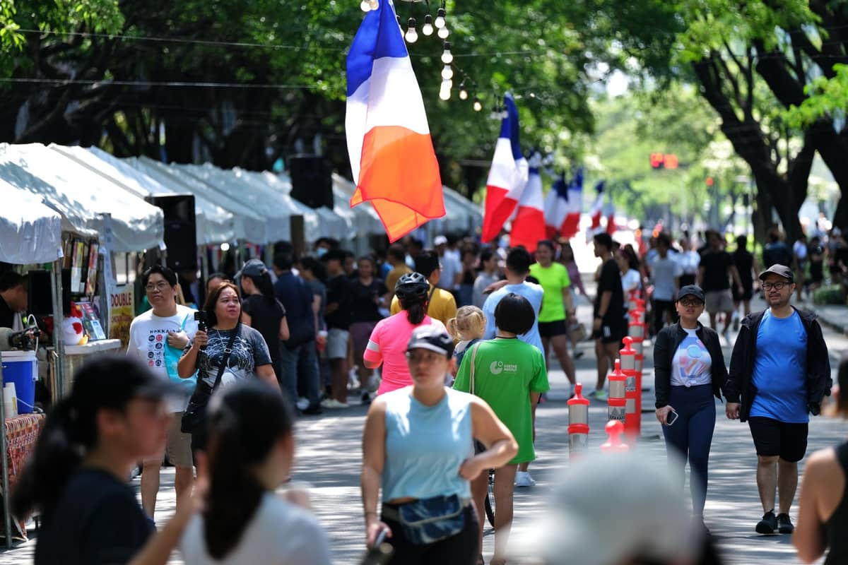 People at the Goût de France’s weekend French Market, on a stretch of Paseo de Roxas, along Ayala Triangle Gardens in Makati.